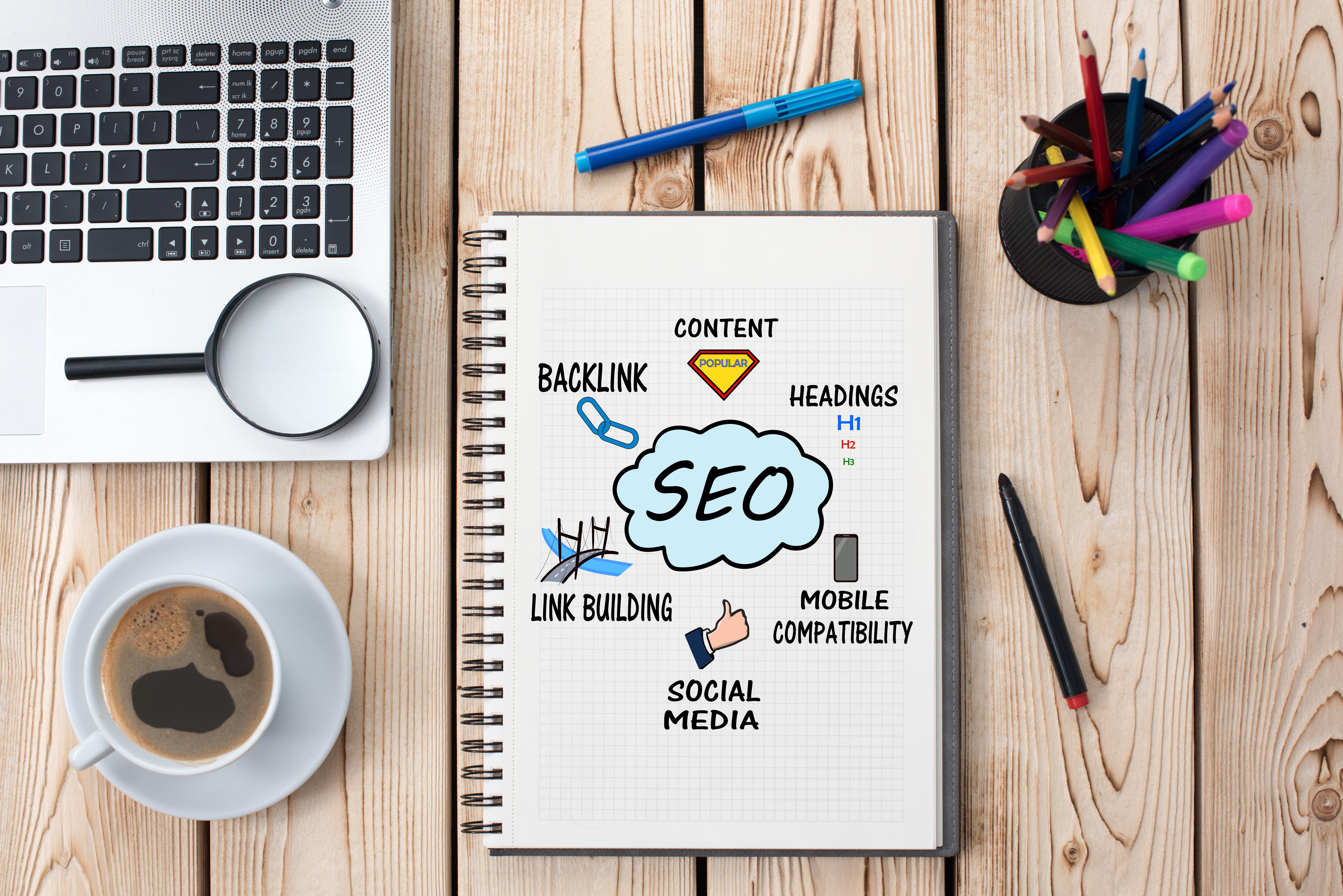 SEO Components in a diagram written in a notebook(Content, Headings, Mobile Compatibility, Social Media, Link Building, Backlink)